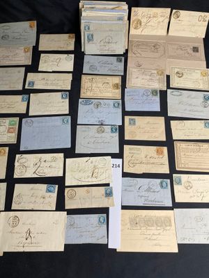 several old letters and envelopes laid out on a table