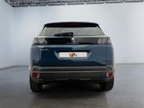 the rear end of a blue suv parked in a garage