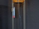 a lamp that is on a stand in a room