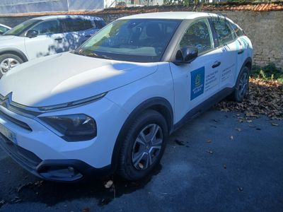 a white car parked on the side of the road