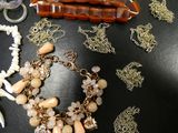 a table with a bunch of jewelry on it