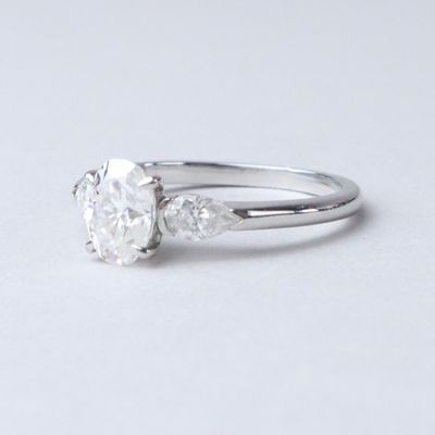 an image of a diamond ring on a white surface