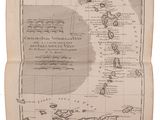 an old book with a map of the world on it