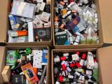 two boxes filled with assorted items sitting on top of a table