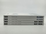three books stacked on top of each other on a table