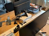 a desk with two monitors, a keyboard, and a mouse on it