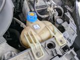 a close up of a car ' s engine with its hood open