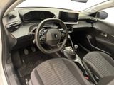 the interior of a small car with a steering wheel and dashboard