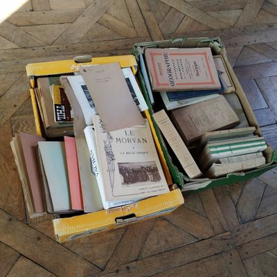 a box full of books sitting on the floor