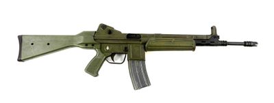 a toy gun with a magazine attached to it on a white surface
