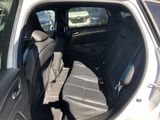 a view of the inside of a car from the back seat