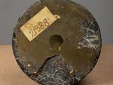 a close up of a piece of marble with a tag on it