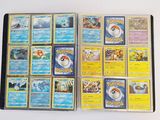 a lot of pokemon cards that are on the table
