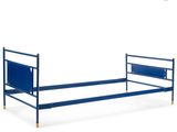 the bed frame is blue and has a metal headboard and foot board