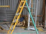 a ladder that is leaning against a wall in a building