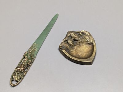 two spoons and a spoon rest on a table