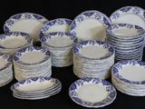 many plates with blue and white designs on them