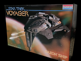 a box with a model of a space ship in it