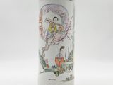a white vase with a picture of a woman and a bird on it