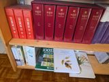 many books that are on a shelf in the room