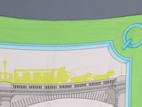 a green scarf with a picture of a train going over a bridge