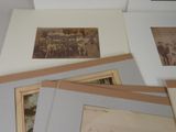 many old photos of people on the wall