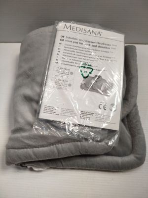 a blanket that is wrapped in plastic on a table