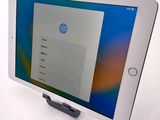 an image of a tablet computer sitting on top of a white table