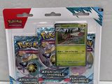 a close up of a box of pokemon cards on a white surface