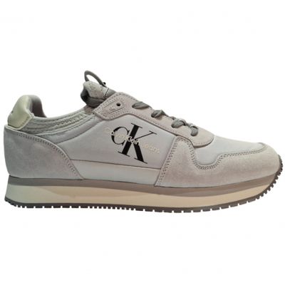 a picture of a pair of grey sneakers with a k logo on the side