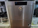 a stainless steel dishwasher in the middle of a kitchen