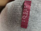 a close up of a hat with a label on it
