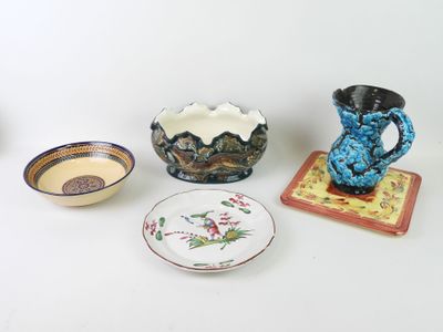 many different types of pottery on the table