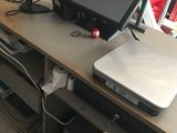 a laptop computer sitting on top of a desk next to a monitor