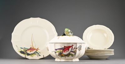 a group of plates and a bowl with a bird on it