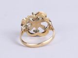 an image of a gold ring with a cross on top of it