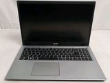 an open laptop computer sitting on top of a white surface