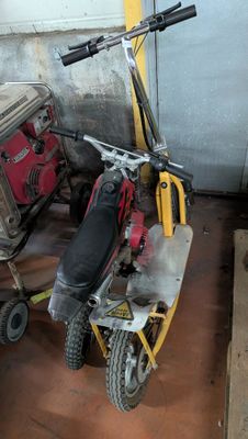 a scooter that is parked in a garage