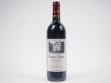 a close up of a bottle of red wine on a white background