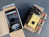a box that has some wires and a remote in it