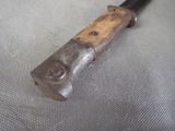 a knife that is laying on top of a table