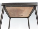 a metal table with a wooden top on a white background