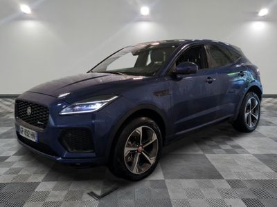 a blue suv parked in a garage with a checkered floor