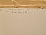 a piece of paper with writing on it sitting on a table