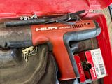 a red tool box with tools in it on a table