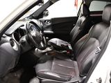 the interior of a white car with black leather seats and a steering wheel