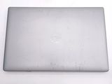 dell laptop computer sitting on top of a table with a white background