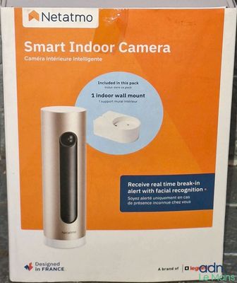 the box of a smart indoor camera sits on the floor
