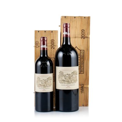 two bottles of red wine in a wooden box