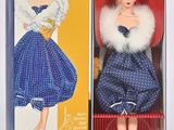 poupée dans une boîte, vêtue d'une robe bleue et d'un col en fourrure blanche